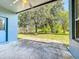 View from patio, overlooking a spacious yard with mature trees and providing a peaceful outdoor space at 12822 Moss Park Ridge Dr, Orlando, FL 32832