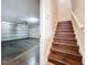 Staircase showcasing wood treads leading up from the garage entrance at 12822 Moss Park Ridge Dr, Orlando, FL 32832
