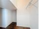 A simple walk-in closet with wire shelving and hardwood floors at 12822 Moss Park Ridge Dr, Orlando, FL 32832