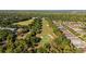 An aerial view of the golf course shows its lush fairways and manicured greens at 1320 Antrim Cir, Ormond Beach, FL 32174