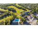 A high-angle view shows the golf course, swimming pool, and community clubhouse at 1320 Antrim Cir, Ormond Beach, FL 32174