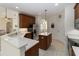 Spacious kitchen featuring stainless steel appliances, island, and light tile flooring at 1320 Antrim Cir, Ormond Beach, FL 32174