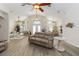 Open-concept living space with hardwood floors, vaulted ceilings, and ample seating for entertaining guests or relaxing at home at 1320 Antrim Cir, Ormond Beach, FL 32174