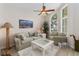 Cozy living room featuring a comfortable sofa, and a large window providing natural light, creating an inviting atmosphere at 1320 Antrim Cir, Ormond Beach, FL 32174