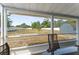 Large backyard view from covered patio with a glimpse of the storage shed at 1328 Laurel Dr, Daytona Beach, FL 32117