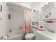 Bathroom featuring a bathtub, shower, and bright white cabinets with decor at 1328 Laurel Dr, Daytona Beach, FL 32117