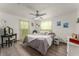 Bedroom featuring a comfortable bed, overhead lighting, and plenty of natural light at 1328 Laurel Dr, Daytona Beach, FL 32117