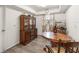 Dining room featuring a wooden dining table, vintage cabinet, and natural light from the window at 1328 Laurel Dr, Daytona Beach, FL 32117