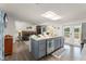 Contemporary kitchen with island seating, stainless appliances, open layout, and seamless flow to living area at 1328 Laurel Dr, Daytona Beach, FL 32117