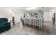 Spacious open-concept living room and kitchen area, featuring modern appliances and wood flooring at 1328 Laurel Dr, Daytona Beach, FL 32117