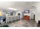 Open-concept living and kitchen area with a large island, wood floors, and abundant natural light at 1328 Laurel Dr, Daytona Beach, FL 32117