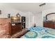Another view of the spacious main bedroom featuring a wooden dresser and decor at 1328 Laurel Dr, Daytona Beach, FL 32117