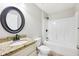 Bathroom featuring granite countertops and tub/shower combo at 13489 Sw 60Th Avenue Rd, Ocala, FL 34473