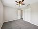 Neutral bedroom with a ceiling fan and closet space at 13489 Sw 60Th Avenue Rd, Ocala, FL 34473
