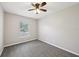 Bedroom featuring plush carpeting and a sunlit window at 13489 Sw 60Th Avenue Rd, Ocala, FL 34473