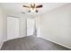Bedroom with a ceiling fan and gray carpeting at 13489 Sw 60Th Avenue Rd, Ocala, FL 34473