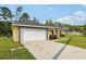 Attractive single-story home with a two-car garage, manicured lawn, and neat landscaping at 13489 Sw 60Th Avenue Rd, Ocala, FL 34473