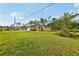 Charming single-story home featuring an attached garage, manicured lawn, and traditional design at 13489 Sw 60Th Avenue Rd, Ocala, FL 34473