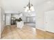 Bright kitchen and dining area with tile floors, stainless steel appliances, and a chandelier at 13489 Sw 60Th Avenue Rd, Ocala, FL 34473