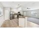 Spacious kitchen with white cabinets, stainless steel appliances, and granite countertops at 13489 Sw 60Th Avenue Rd, Ocala, FL 34473