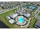 Aerial view of community pool, clubhouse, tennis, basketball and pickleball courts at 13617 Haulover Beach Ln, Orlando, FL 32827