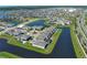 Picturesque aerial view of a lakeside community with stunning homes and winding waterways at 13617 Haulover Beach Ln, Orlando, FL 32827