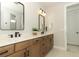 Modern bathroom with dual vanity, stylish mirrors, and sleek fixtures at 13617 Haulover Beach Ln, Orlando, FL 32827