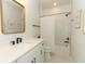 A bright bathroom featuring a large vanity, shower-over-tub, and modern fixtures at 13617 Haulover Beach Ln, Orlando, FL 32827
