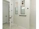 Bright bathroom featuring a frameless glass shower with subway tile and black hardware accents at 13617 Haulover Beach Ln, Orlando, FL 32827