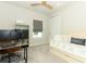 Bedroom with a desk area, closet, large computer monitor, and comfortable daybed; perfect for study or relaxation at 13617 Haulover Beach Ln, Orlando, FL 32827