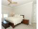Neutral bedroom featuring a wooden ceiling fan, a comfortable bed and plush carpet at 13617 Haulover Beach Ln, Orlando, FL 32827