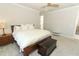Bedroom with plush carpeting, a king bed and adjacent access to the second story at 13617 Haulover Beach Ln, Orlando, FL 32827