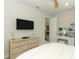 Comfortable bedroom with soft lighting, plenty of storage space, and access to the upper floor at 13617 Haulover Beach Ln, Orlando, FL 32827