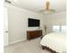 Bedroom features a modern ceiling fan and plush carpeting with a television wall mount at 13617 Haulover Beach Ln, Orlando, FL 32827