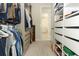 Spacious walk-in closet with custom shelving for optimal organization and storage at 13617 Haulover Beach Ln, Orlando, FL 32827