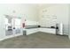 Well-lit clubhouse featuring a kitchenette area with stainless steel appliances and ample cabinet space at 13617 Haulover Beach Ln, Orlando, FL 32827