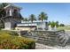 Elegant 'Isles of Lake Nona' entrance sign with stacked stone and a tiered waterfall feature at 13617 Haulover Beach Ln, Orlando, FL 32827
