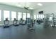 Well-lit community gym with treadmills, stationary bikes, and weight training equipment at 13617 Haulover Beach Ln, Orlando, FL 32827