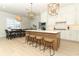 Bright, modern kitchen with a large island, pendant lighting, and ample seating for casual dining at 13617 Haulover Beach Ln, Orlando, FL 32827