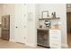Cozy kitchenette area with a beverage cooler, espresso machine, and convenient shelving for storage at 13617 Haulover Beach Ln, Orlando, FL 32827