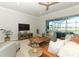 Inviting living room showcasing a comfortable seating area and seamless access to the screened lanai at 13617 Haulover Beach Ln, Orlando, FL 32827