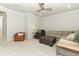 Spacious living room with sectional sofa, leather chairs, ceiling fan and recessed lighting at 13617 Haulover Beach Ln, Orlando, FL 32827