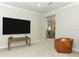 Open loft area with plush carpet, media center and access to the second story at 13617 Haulover Beach Ln, Orlando, FL 32827