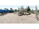 Community playground with modern play structures, benches, and a safe, cushioned ground surface at 13617 Haulover Beach Ln, Orlando, FL 32827