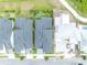 Aerial view showcases community street layout with modern architecture and manicured landscaping at 14559 Walcott Ave, Orlando, FL 32827