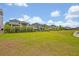 Beautifully landscaped backyard featuring lush grass, manicured hedges, and mature trees in a tranquil setting at 14559 Walcott Ave, Orlando, FL 32827