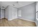 Spacious bedroom with white trim and doors, neutral walls, and wood floors to provide a serene living space at 14559 Walcott Ave, Orlando, FL 32827