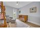 Charming Bedroom with a wooden crib, cozy chair, and access to an outdoor balcony for fresh air and scenic views at 14559 Walcott Ave, Orlando, FL 32827
