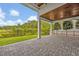 Paver patio with stunning landscaping and mature trees, perfect for relaxing outdoors at 14559 Walcott Ave, Orlando, FL 32827