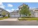 Charming two-story home with manicured landscaping and a spacious three-car garage at 14559 Walcott Ave, Orlando, FL 32827